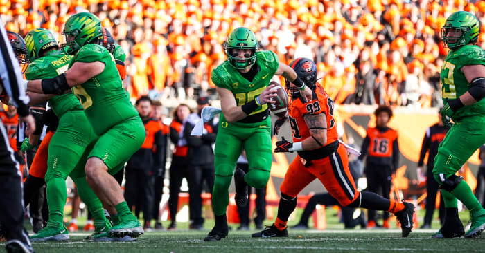 Oregon Ducks quarterback Bo Nix runs against the Oregon State Beavers on November 26 at Reser Stadium in Corvallis.